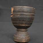 Inca ritual vessel made of wood with a dark patina and ceremonial shape