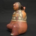 Nasca Ceramic Bottle – Seated Female Figure with Dagger and Painted Motifs