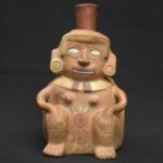 👁️ Moche ceramic bottle with a seated figure
