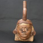 Pre-Columbian Moche Ritual Ceramic Bottle with Face - Imagen 2