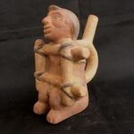 Pre-Columbian Moche Ceramic Bottle with Human Figure