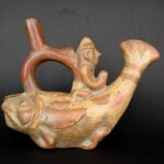 Ancient pre-Columbian Moche ceramic instrument representing a fisherman